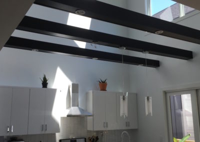 black-kitchen-beams-white-walls