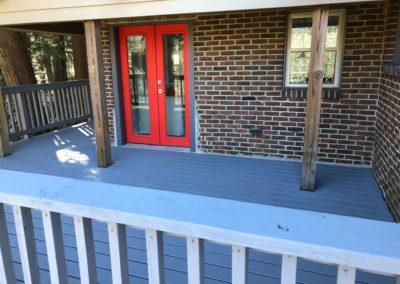 freshly-painted-grey-deck-with-red-door